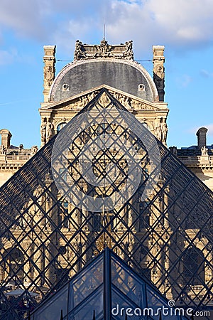 Louvre Museum facade at sunset Editorial Stock Photo