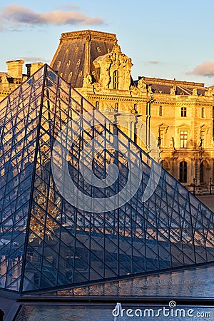 Louvre Museum facade at sunset Editorial Stock Photo