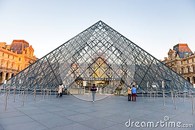 Louvre museum with landmark entrance - pyramid Editorial Stock Photo