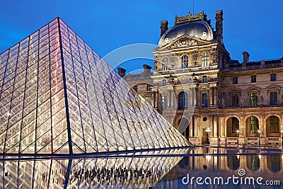 Louvre museum and pyramid, night in Paris Editorial Stock Photo