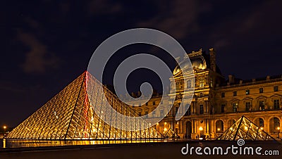 Louvre Museum and the Pyramid in Paris, France, at night illumi Editorial Stock Photo