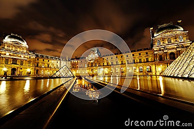 Louvre Museum and Pyramid night view, Paris, France Editorial Stock Photo