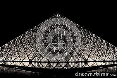 Louvre pyramid in Paris by night Editorial Stock Photo