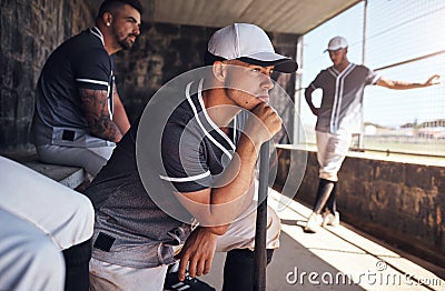 For the love of baseball. a young man watching a game of baseball from behind the fence. Stock Photo