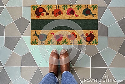 Love Birds Door mat with Brown shoes Welcome entry designer doormat Stock Photo