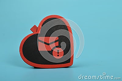 Love board and email symbol. The concept of love scams online involves using email phishing scams Stock Photo