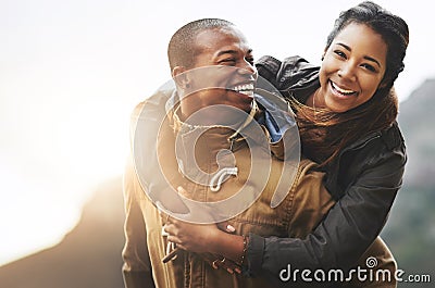 Love brings out the best in us. Portrait of a happy young couple having fun outside. Stock Photo