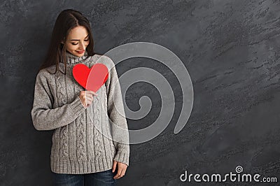 Kind woman with red paper heart Stock Photo