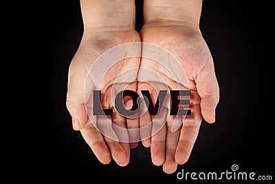 Love in child's hands Stock Photo