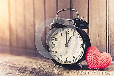 Love clock vintage tone timed 1 o`clock. Stock Photo