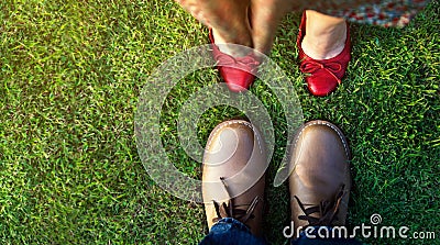 Love Concept, Low Section of Couple Kissing in the Park. Top Vie Stock Photo