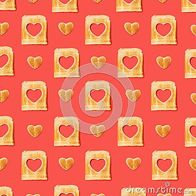 Love concept. Pattern made of slices of toasted bread with a heart shaped tost . Flat lay arrangement with red background Stock Photo