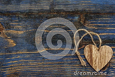 Love concept for Valentines day or mothers day. Card with space for text. Natural heart, old wooden boards background Stock Photo