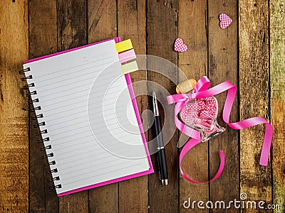 Love diary - blank spiral notebook and pen on wood Stock Photo