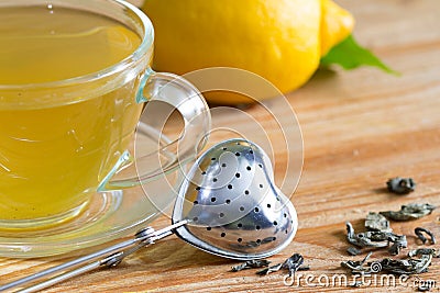 Love drinking tea with infuser heart valentines abstract concept on wooden background Stock Photo