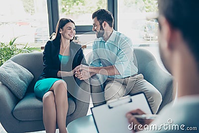 Love, family, psychology and happiness concept - young couple hugging at psychologist office, they are so happy, they cured from Stock Photo