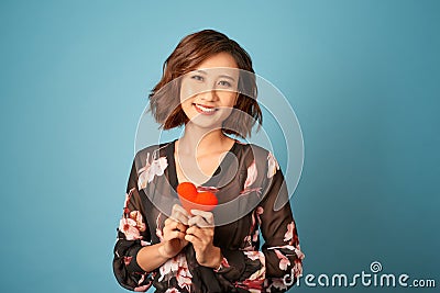 Love from first sight. Woman in stylish dress hold symbol love Stock Photo