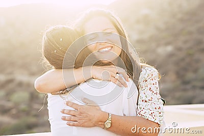 Love and friendship concept twith couple of women young friends hugging and smiling with love - diversity for caucasian people - Stock Photo