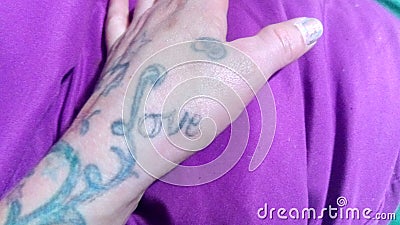 Love hand purple fingers tattoo Editorial Stock Photo