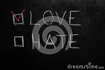 Love or Hate on black chalkboard Stock Photo