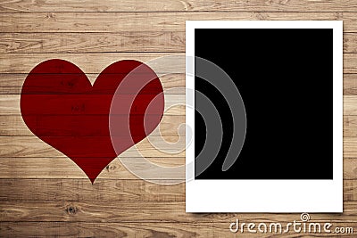 Love heart and Photo frame on Brown wood plank wall Stock Photo