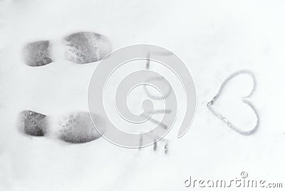 Love heart sign writen on the snow Stock Photo