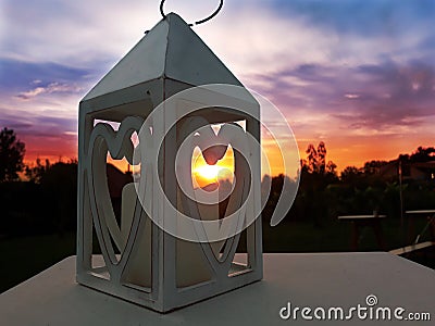 Love heart symbols candle holder sunset Stock Photo