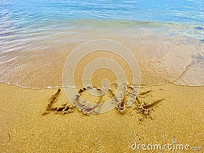 Love inscription on the beach Stock Photo