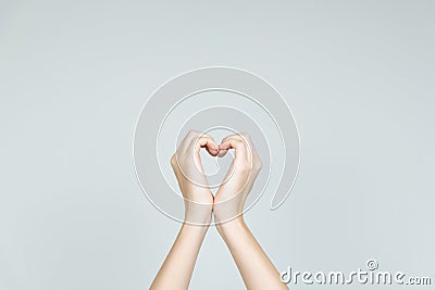 Love and kindness concept: hands forming the shape of heart. Stock Photo