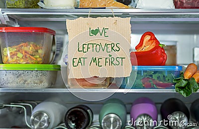 Love Leftovers Eat Me First handmade sign in fridge Stock Photo