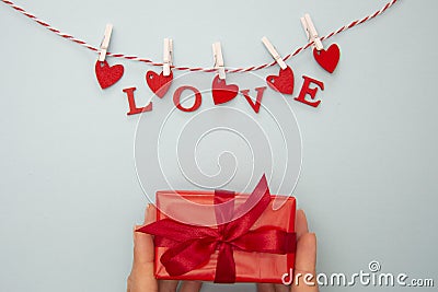 Love letters hanging on a rope. Abstract Valentine& x27;s Day background with copy space Stock Photo