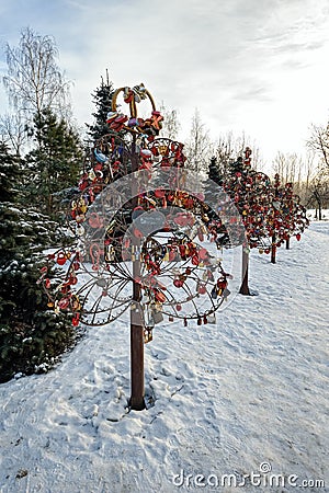 Love locks attached to the metal trees Editorial Stock Photo