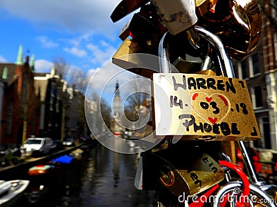 Love locks on a bridge in Amsterdam, Holland Editorial Stock Photo