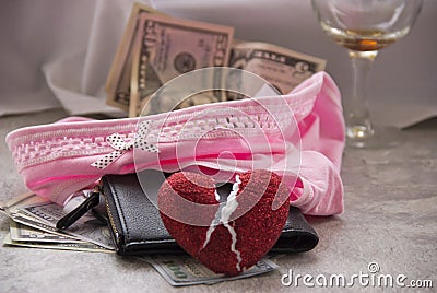 Love for money is prostitution. A crumpled sheet, a glass of wine and money in her underwear are sex fees Stock Photo