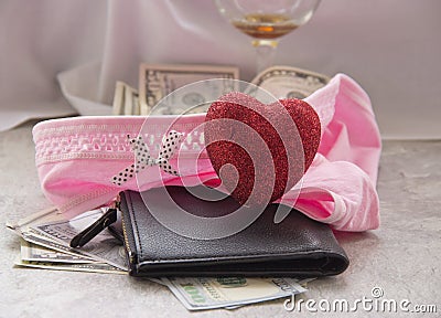 Love for money is prostitution. A crumpled sheet, a glass of wine and money in her underwear are sex fees Stock Photo