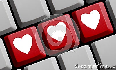 Love online - 3 Hearts on red Computer keyboard Stock Photo