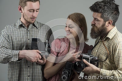 We love photo. Photography studio. Paparazzi or photojournalists with vintage old cameras. Group of photographers with Stock Photo
