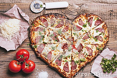 Love pizza. Baked heart-shaped homemade pizza Stock Photo