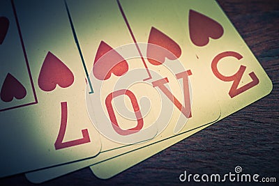 Love, poker playing cards with heart symbol that form the written love Stock Photo