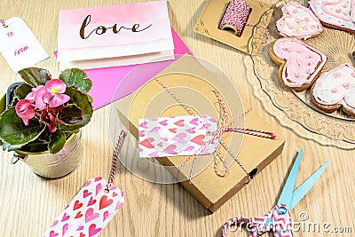 Love present,Begonia,cards and cookies on the wooden table Stock Photo