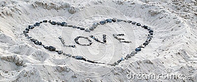 Love proof in the sand Stock Photo