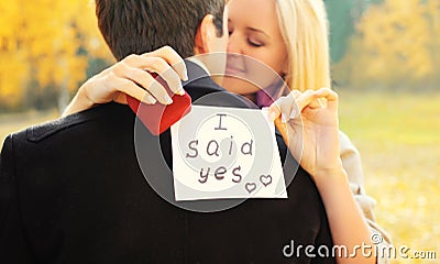 Love, relationships, engagement and wedding concept - man proposes a woman to marry, red box ring, happy young romantic couple Stock Photo