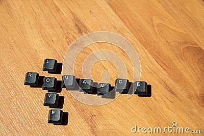 Love and Romance word on the laminate floor2 Stock Photo