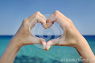 Love sea hand heart gesture Stock Photo