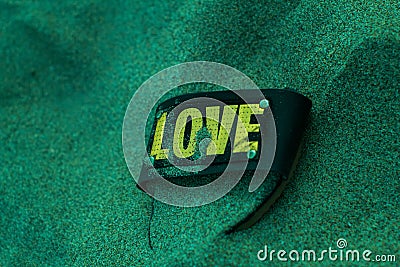 Love shoe in the sand. Stock Photo