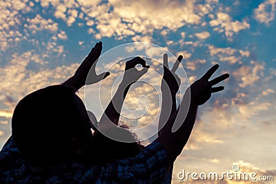 Love sign language at the sunset time Stock Photo