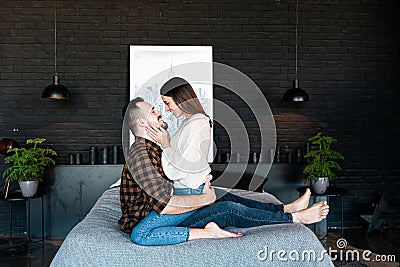 Love story at bedroom. Couple in love on bed Stock Photo