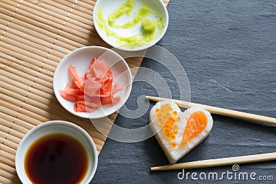 Love sushi abstract menu concept with nigiri heart on black background Stock Photo