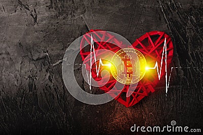 Love to bitcoins. Coin Bitcoin lies on a red heart Stock Photo