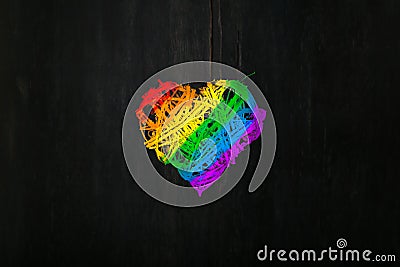 Love Valentines heart wreath in rainbow pride colours dark background Stock Photo